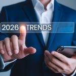 businessman holding cell phone 2026