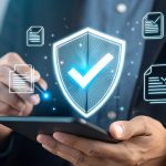 business man holding cell phone with compliant check mark