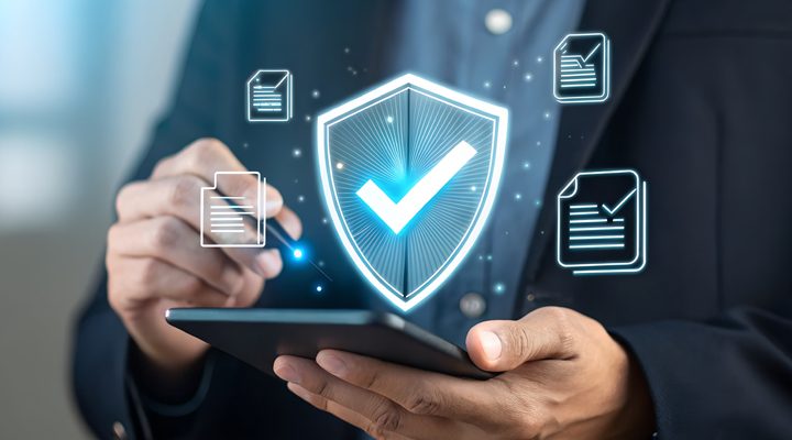 business man holding cell phone with compliant check mark