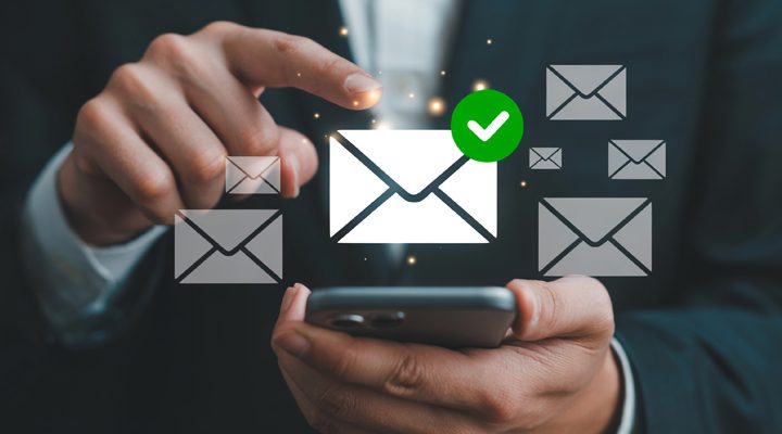 businessman holding cell phone with text messages